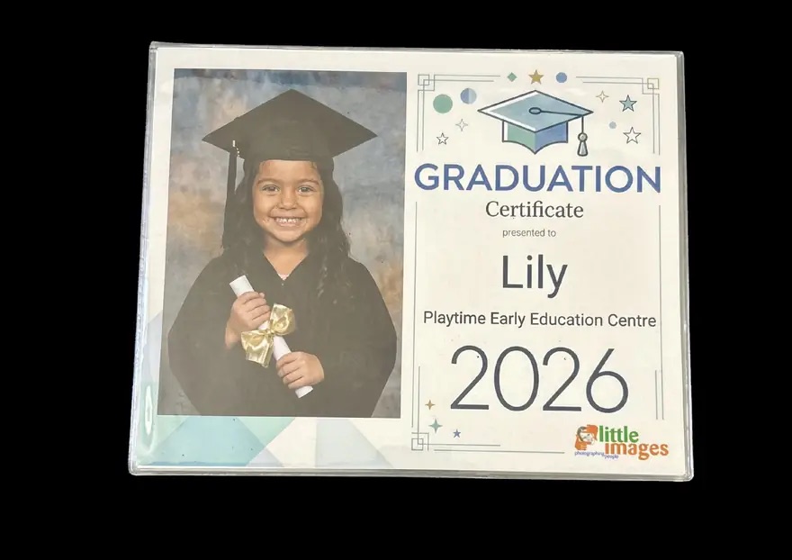 Back cover of the keepsake book: a personalised graduation certificate with the child's portrait, name, centre, and year